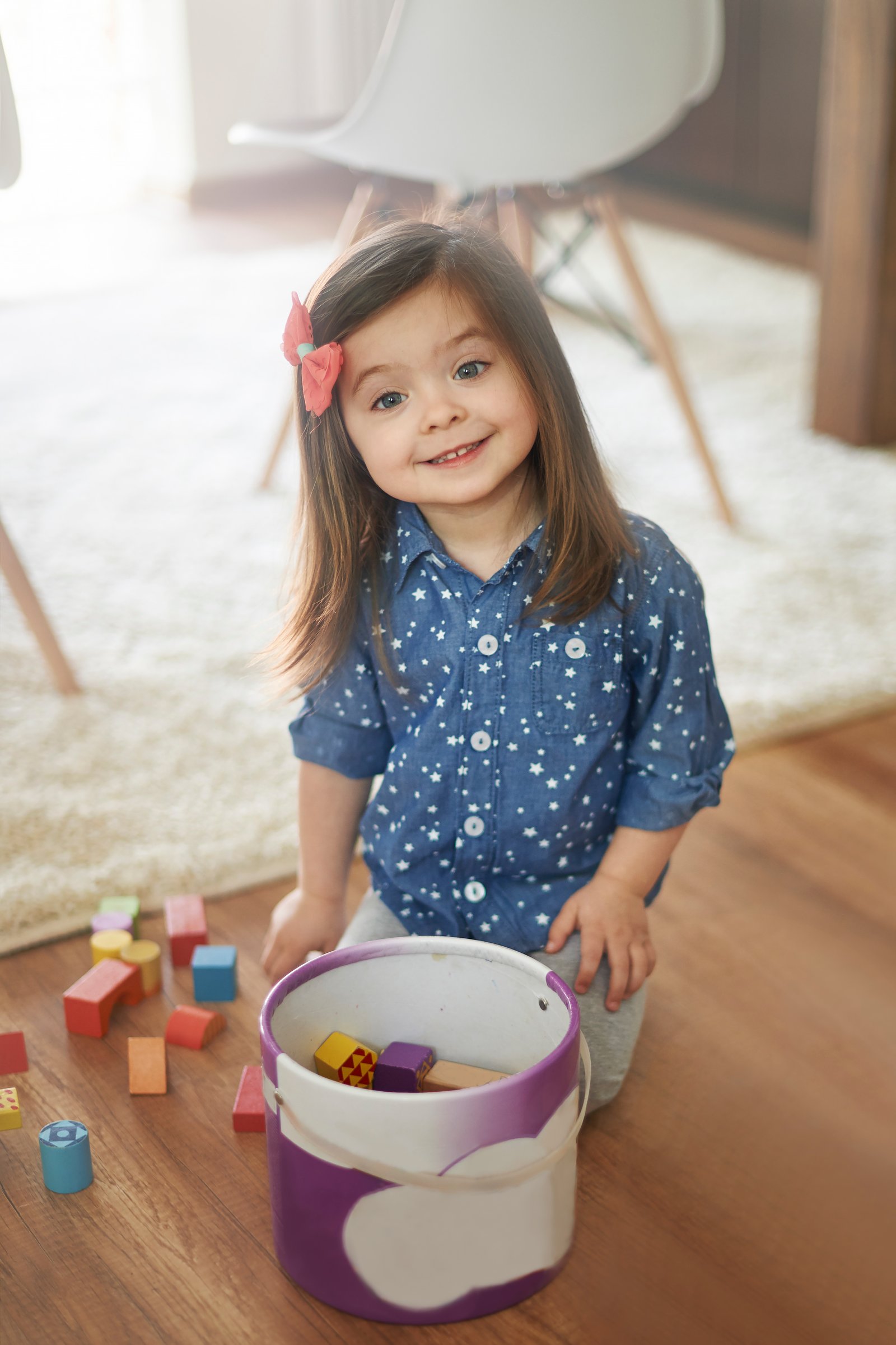 Maplewood child tidying up after play